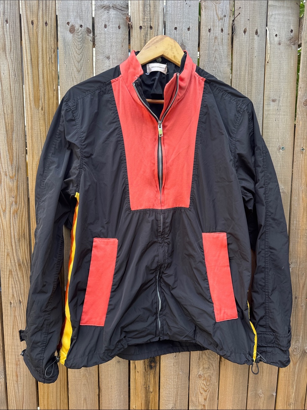 Wales Bonner Black Windbreaker with Red Panels and Yellow Stripes